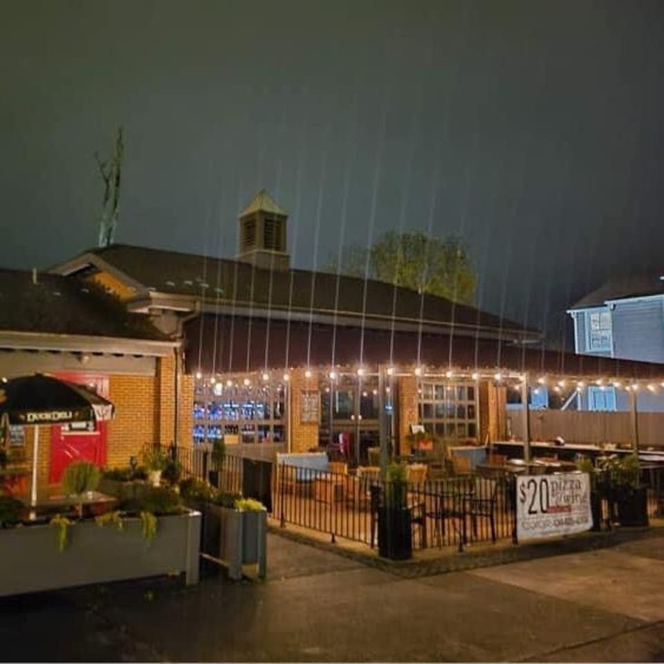 Crema & Vine exterior and patio at night.