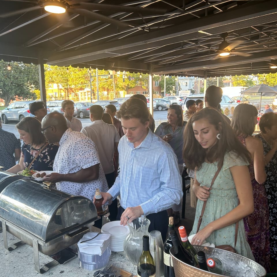 Guests enjoying a patio buffet.